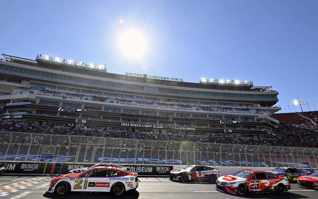 Nascar on the track at a full stadium
