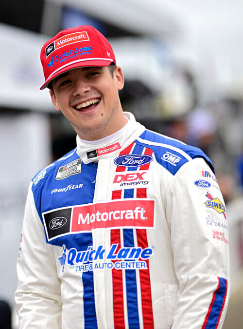 Harrison Burton with an open mouth smile