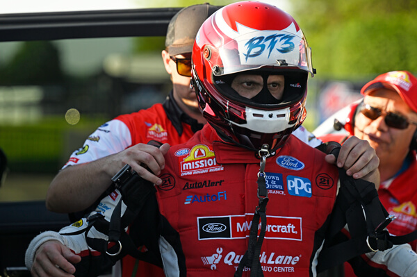 Tasca putting on safety gear