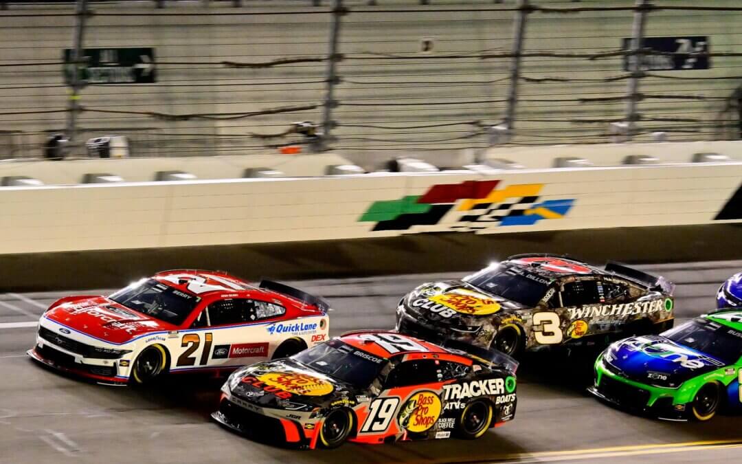 Multiple NASCARs on the track