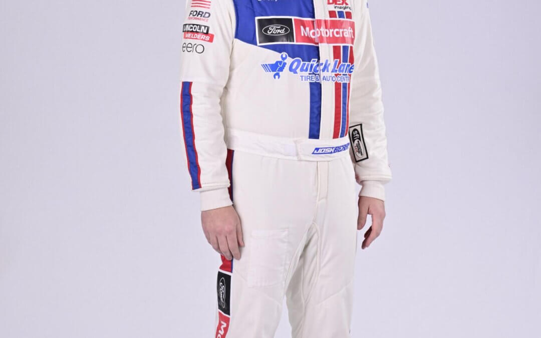Josh Berry in full suit standing for a photoshoot
