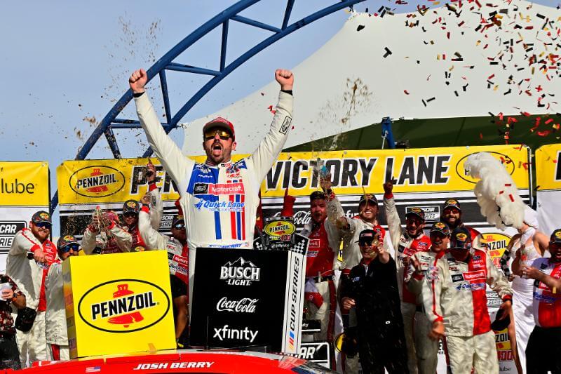 Josh Berry Celebrating his win with Penzoil placed in the foreground