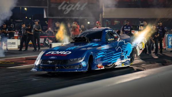 Ford Performance wrapped car taking off with flames behind it