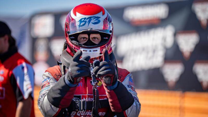 Tasca close up of putting on his helmet