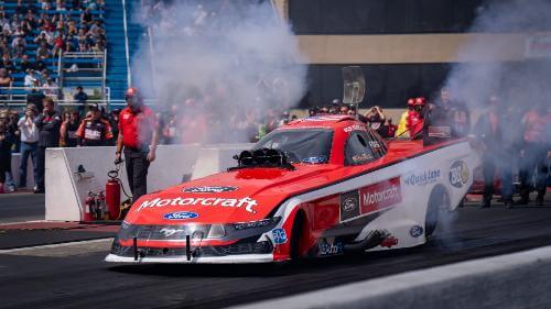 Front of the NHRA funny car on track at take off