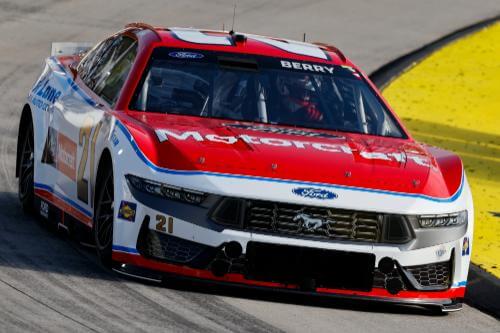 Zoomed in head on shot of car 21 and driver