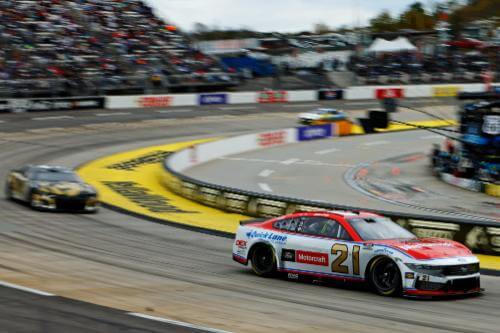 Number 21 car coming around the track corner