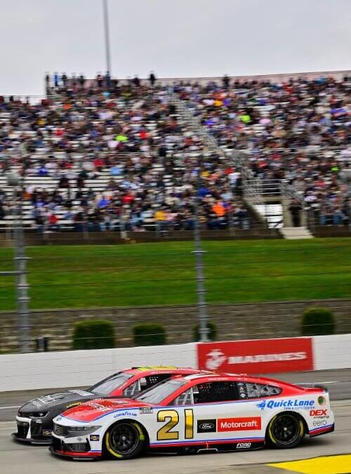Portrait view of the number 21 car and the crowd in the background
