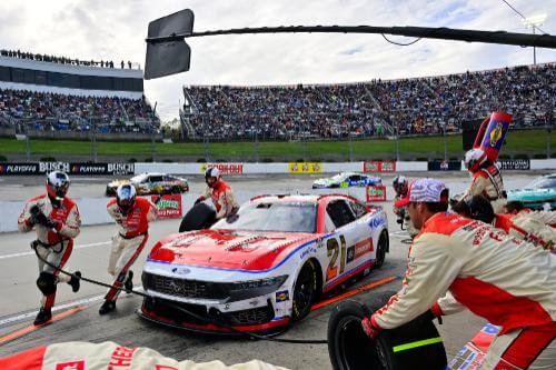 Pit crew working on car number 21