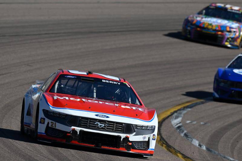 Number 21 car on track coming around the corner