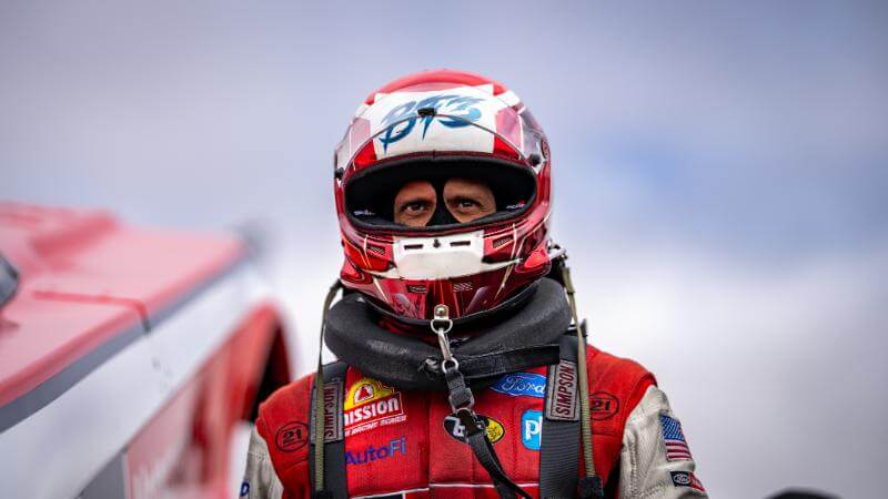 Epic shot of Tasca with safety gear on and a blue cloudy background