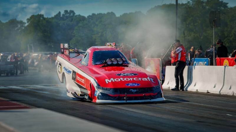 Funny car with smoke on track