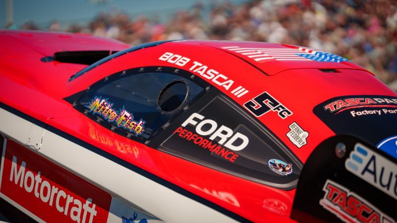 View of the side window of the funny car showing Ford Performance sticker