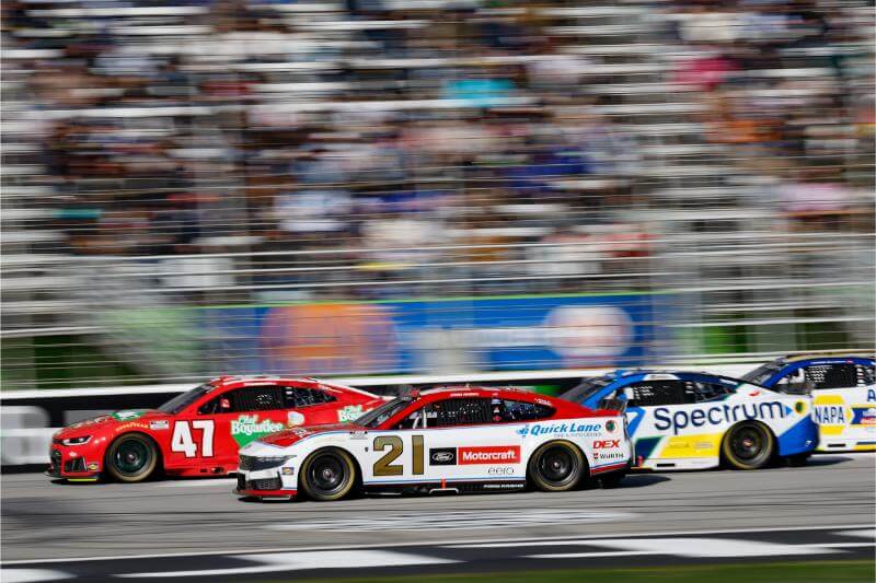 Blurred background shot of cars on track