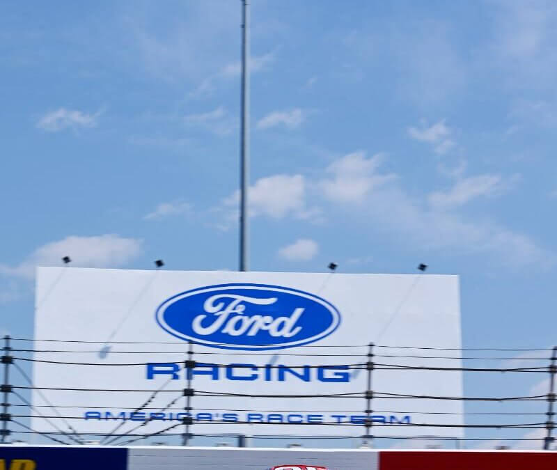 Ford Racing sign and logo at the track