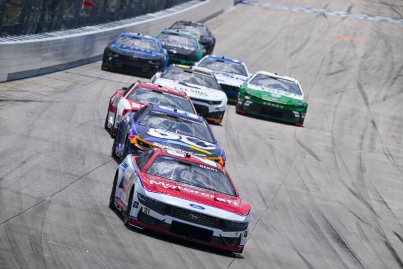 Front view of cars coming down the track